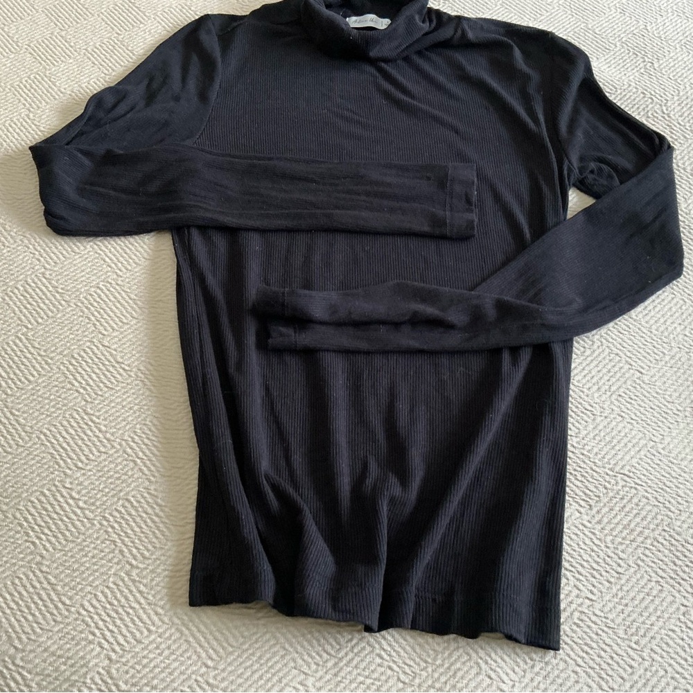 Woman’s Black Turtleneck Sweater